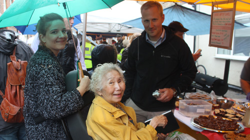 Lulu Taylor (centre) considers the cakes at Baptist chapel stall