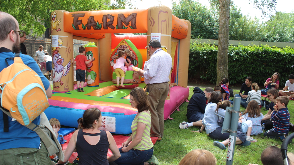 Dawson Place hosts the bouncy castle with Councillor Colin Cook in charge