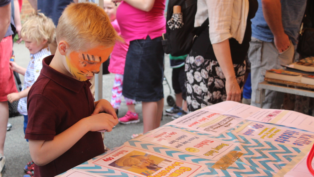 A young  Morlan thinks about buying a ticket for the Sumo wrestling