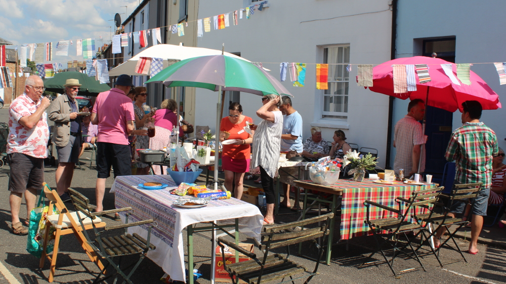 John Mair, far left,  organizer of the Nelson Street party. Tags were used here too, but of a lower-tech sticky-label type that helped people keep track of new friends.