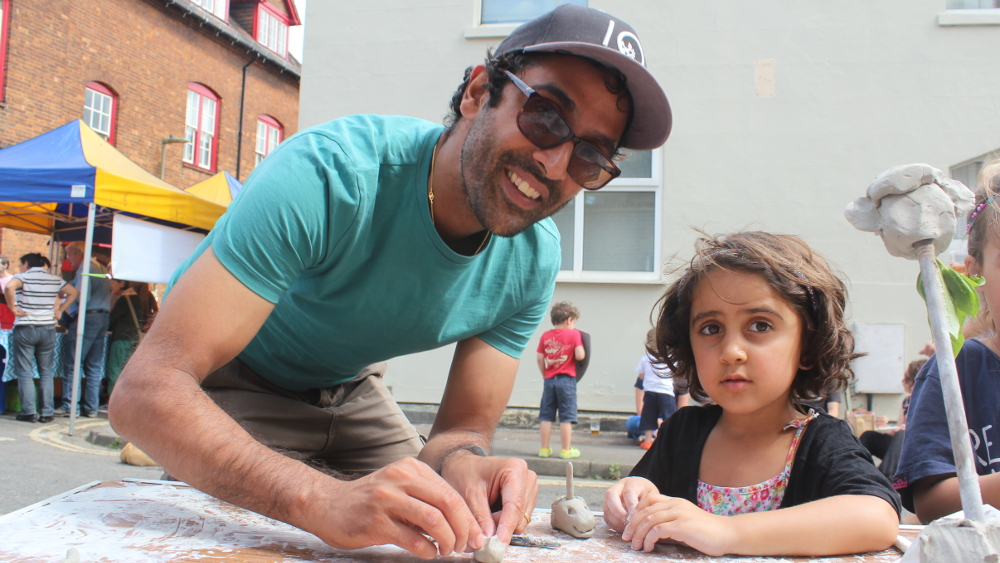 Model parenting -- father and daughter get creative with clay