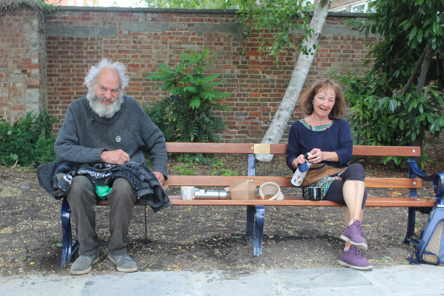 Ed Pope and Sue Hughes enjoy coffee and croissants - at a suitable distance